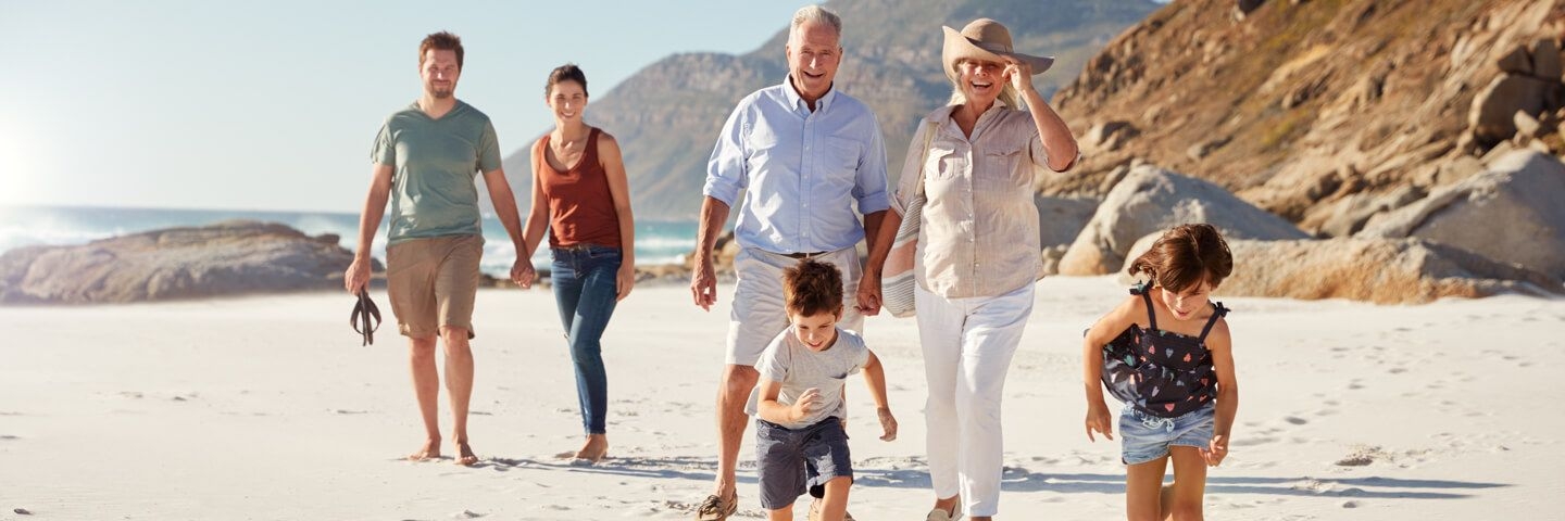 Family walk on beach